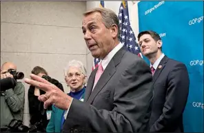  ?? AP/J. SCOTT APPLEWHITE ?? House Speaker John Boehner (center), joined by Rep. Paul Ryan (right) and Rep. Virginia Foxx, answers reporters’ questions Wednesday at the Capitol.
