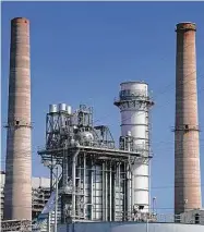  ?? Elizabeth Conley/staff photograph­er ?? The Petra Nova carbon capture plant sits between two stacks at NRG’S WA Parish power plant in Richmond.