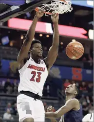  ?? Nell Redmond / Associated Press ?? Louisville’s Steven Enoch (23) dunks past Notre Dame’s Juwan Durham during a 2019 ACC Tournament game.