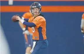  ??  ?? Coach Gary Kubiak says Peyton Manning, throwing Thursday at practice inside the Broncos’ field house, is receiving “a lot of work.” Cyrus McCrimmon, The Denver Post