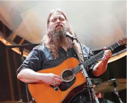  ?? [PHOTO BY AL WAGNER, INVISION/AP, FILE] ?? Chris Stapleton performs Aug. 22 at the 12th Annual ACM Honors at the Ryman Auditorium in Nashville, Tenn. Stapleton tops the list of finalists with five nomination­s for the 52nd annual Country Music Associatio­n Awards.