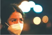  ?? AP PHOTO/GREGORY BULL ?? Marely, 12, of El Salvador, cries as she waits to be processed by authoritie­s after turning herself in upon crossing the U.S -Mexico border Tuesday in La Joya, Texas.