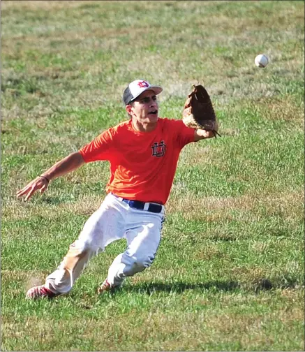  ?? Photos by Ernest A. Brown ?? Above, former Cumberland standout and current Bridgewate­r State College athlete Michael Nocera makes a sliding catch during Upper Deck’s 7-0 victory over Smithfield/North Providence at Smithfield High Friday. Below, Cumberland’s Shane Calabro slides safely into second.