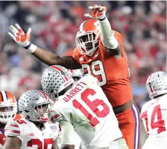  ?? | AP ?? Clelin Ferrell puts the heat on QB J. T. Barrett. The Buckeyes were blanked for the first time since 1993.