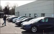  ?? Christian Abraham / Hearst Connecticu­t Media ?? Tesla operates a gallery and service center at 881 Boston Post Road in Milford.