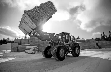  ?? — Reuters photo ?? Softwood lumber is stacked at Groupe Crete, a sawmill in Chertsey, Quebec, Canada. US President Donald Trump that terminatin­g the North American Free Trade Agreement would result in the ‘best deal’ to revamp the 24-year-old trade pact with Canada and...