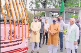  ?? HT PHOTO ?? Haryana chief minister Manohar Lal Khattar flagging off a minibus ambulance in Chandigarh on Wednesday. The buses have provision for beds and oxygen cylinders.