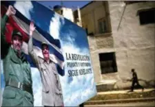  ?? RAMON ESPINOSA — THE ASSOCIATED PRESS ?? A poster of Fidel Castro and Cuba’s President Raul Castro stands in Havana, Cuba, Wednesday. The Cuban government on Wednesday selected 57-year-old First Vice President Miguel Mario Diaz-Canel Bermudez as the sole candidate to succeed Raul Castro in a...