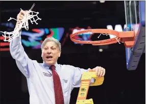  ?? Nam Y. Huh / Associated Press ?? DePaul coach Doug Bruno celebrates while cutting down the net after beating Marquette to win March’s Big East championsh­ip in Chicago.