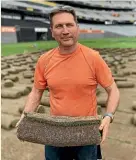  ??  ?? Online buyer Ashley Witheford collects his piece of Eden Park turf before Christmas.