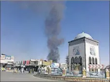  ??  ?? Smoke rises after fierce fighting in Kandahar.