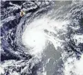  ??  ?? This satellite image released Tuesday shows Hurricane Lane near the Big Island of Hawaii (upper left). NASA/AP