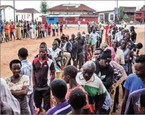  ?? STRINGER/AFP ?? People wait in line in Ngozi, northern Burundi, to vote in a referendum on controvers­ial constituti­onal reforms on Thursday.
