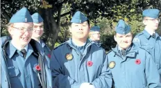  ?? ALLAN BENNER/STANDARD STAFF ?? About 50 members of Royal Canadian Air Cadets 23 Optimist Squadron in St. Catharines spent the night before Remembranc­e Day standing guard at the cenotaph on St. Paul Street, including Nicholas Chaffee, from left, Shawn Chen and Brittany Smith.