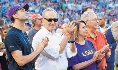  ?? ALEX BRANDON/ASSOCIATED PRESS ?? House Speaker Paul Ryan, R-Wis., Senate Minority Leader Chuck Schumer, D-N.Y., House Minority Leader Nancy Pelosi, D-Calif., and Senate Majority Leader Mitch McConnell, R-Ky., applaud a message from President Donald Trump before Thursday night’s game.