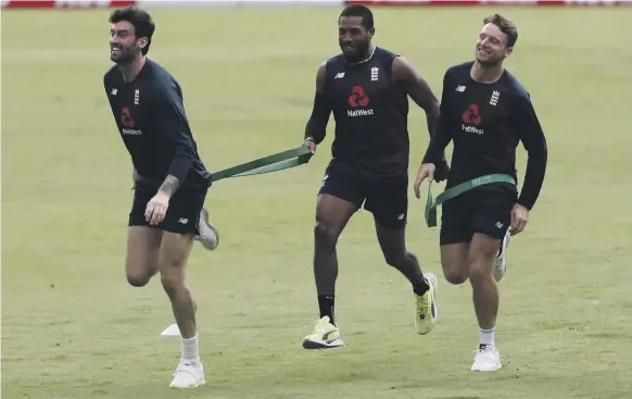  ?? Reuters ?? From left, England’s Reece Topley, Chris Jordan and Jos Buttler train in Pune for the first of a three-match ODI series against India
