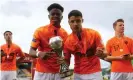  ??  ?? Sontje Hansen and Dutch teammate Soulyman Allouch celebrate with the Euro Under-17 trophy in Dublin. Photograph: Philip Oldham/BPI/Shuttersto­ck