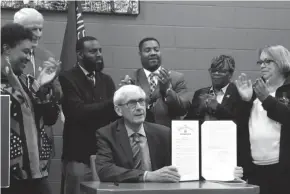  ?? MILWAUKEE JOURNAL SENTINEL TALIS SHELBOURNE / ?? Wisconsin Gov. Tony Evers displays the executive order he signed Oct. 28, 2019, creating a Complete Count Committee for the 2020 census.