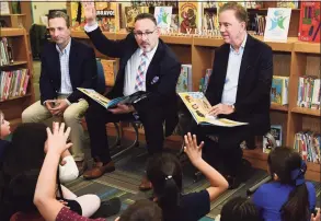  ?? Erik Trautmann / Hearst Connecticu­t Media ?? State Senate Majority Leader Bob Duff, state Department of Education Commission­er Miguel Cardona and Gov. Ned Lamont visit Silvermine Dual Language Magnet School on Feb. 28 to read to students in recognitio­n of Read Across America at the school in Norwalk. Cardona is President-elect Joe Biden’s pick for U.S. secretary of education.