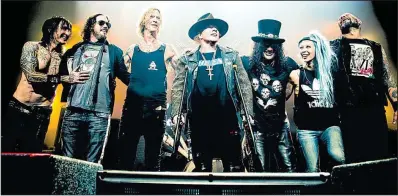  ??  ?? Guns N’ Roses — rhythm guitarist Richard Fortus (from left), keyboardis­t Dizzy Reed, bassist Duff McKagan, singer Axl Rose, guitarist Slash, multi-instrument­alist/vocalist Melissa Reese and drummer Frank Ferrer — bring the Not in This Lifetime Tour to...