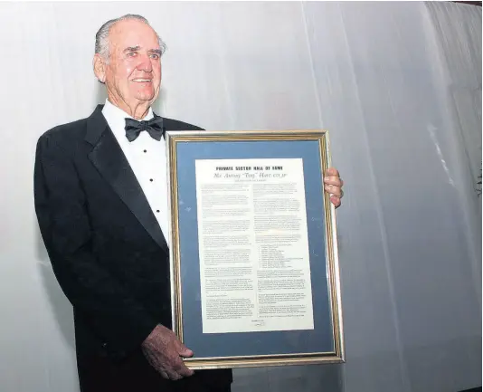  ??  ?? Tony Hart with his citation after being inducted into the PSOJ Hall of Fame.