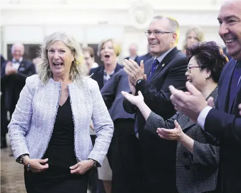  ?? SEAN KILPATRICK/THE CANADIAN PRES ?? New Conservati­ve MP Leona Alleslev is welcomed at the party’s caucus meeting on Parliament Hill on Wednesday after the Toronto-area MP crossed the floor from the ruling Liberals.