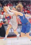  ?? JIM THOMPSON/JOURNAL ?? Cherise Beynon, left, has become the second Lobo to produce 1,000 points, 500 assists and 500 rebounds in her career.