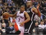  ?? VINCE TALOTTA/TORONTO STAR ?? The Nets’ Jarrett Jack tries not to foul Raptors’ Kyle Lowry during play at the ACC on Wednesday.