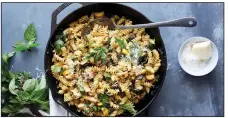  ?? (The New York Times/Linda Xiao) ?? Colu Henry’s Zucchini and Squash Pasta adds lemon and a few big handfuls of fresh herbs for flavor, texture and overall zing.