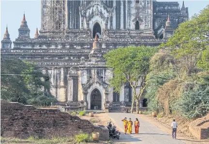  ?? ?? The Kyaw Thaung family donated money toward the restoratio­n of the Thatbyinny­u Temple in Bagan in 2002.