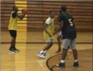  ?? NATE BARNES — THE NEWS-HERALD ?? Euclid point guard Garvin Clarke prepares to pass during a preseason practice Nov. 27.