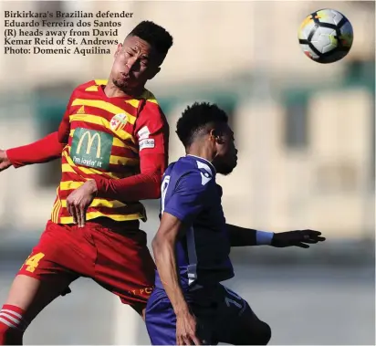  ??  ?? was ruled out through suspension.The match was characteri­sed by the strong wind with the Saints enjoying the lion’s share of the attacking in the first half and Birkirkara taking the initiative in the second period.With the wind at their backs, the Saints created the best half chances but they failed to take advantage as they failed to score at least one goal.Birkirkara found it rather hard to move forward, mostly because of the strong wind, and they only were dangerous on one occasion and that was from a set-piece.In the second half, it was a dif- Birkirkara's Brazilian defender Eduardo Ferreira dos Santos (R) heads away from David Kemar Reid of St. Andrews Photo: Domenic Aquilina