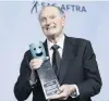  ?? PHOTO: TNS ?? Alan Alda holds the lifetime achievemen­t award given by his fellow actors yesterday at the SAG Awards, after his 60year career on stage and screen. Alda (82) announced in July that he was diagnosed with Parkinson’s disease three years ago.