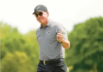  ?? SETH WENIG/AP ?? Phil Mickelson celebrates after a birdie on the fifth hole during the second round of the PGA Championsh­ip at Oak Hill Country Club on Friday in Pittsford, New York.