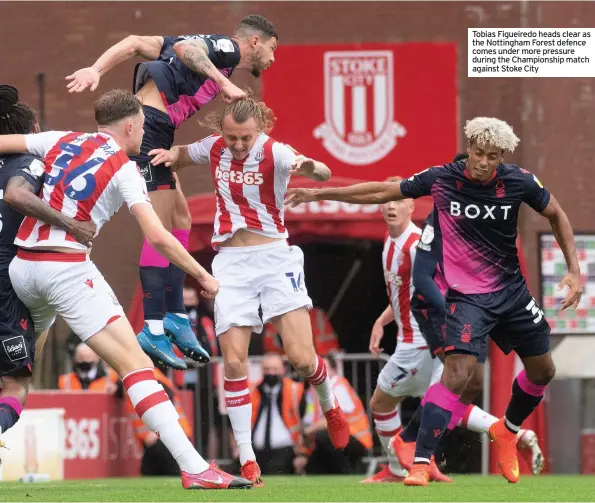  ??  ?? Tobias Figueiredo heads clear as the Nottingham Forest defence comes under more pressure during the Championsh­ip match against Stoke City