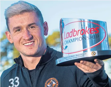  ?? Picture: SNS. ?? Dundee United’s Fraser Aird with his Ladbrokes Championsh­ip player of the month award.