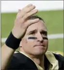  ?? AP file photo ?? Drew Brees waves to his family and fans after the Saints’ playoff loss to the Buccaneers on Jan. 17. Brees announced his retirement Sunday after 20 NFL seasons, including the last 15 with New Orleans.