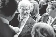  ?? By Evan Vucci, AP ?? Distant second: Former House speaker Newt Gingrich shakes hands during a campaign event last week in Las Vegas. He took about 22% of the caucus vote.