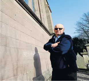  ?? Picture: Dougie Nicolson. ?? Session clerk Douglas Taylor beside some of the vandalism at the cathedral.