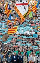  ??  ?? DEFIANCE: Thousands of Catalans on the streets of Barcelona yesterday