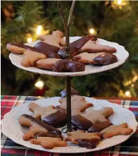  ?? Tribune News Service ?? ■ Chocolate-Dipped Orange Shortbread Holiday Cookies.