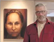  ??  ?? Artist Glenn Szegedy with his portrait of Anna Jabar-omoyeni, culinary teacher at Youthbuild Lowell.