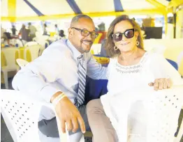  ?? ?? Christophe­r Barnes, chief operating officer at the RJRGLEANER Communicat­ions Group with Stephanie Scott at a Restaurant Week event.