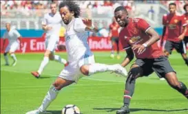  ?? AFP ?? Real Madrid’s Marcelo Da Silva (L) and Manchester United’s Timothy FosuMensah vie for the ball during their Internatio­nal Champions Cup match at Levi's Stadium in Santa Clara on Sunday.