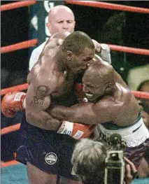  ?? JACK SMITH / AP 1997 ?? When Mike Tyson bit into Evander Holyfield’s ear in the third round of their WBA heavyweigh­t match 25 years ago today, it was an act that turned the most anticipate­d fight in over decade into a night of total anarchy.