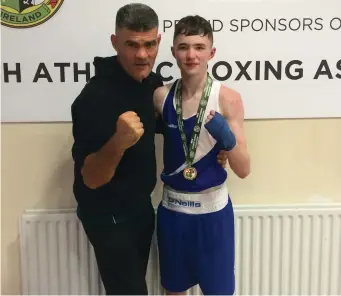  ??  ?? Boxer Dean Clancy with Stephen Reynolds after his win on Friday night in the National Stadium.