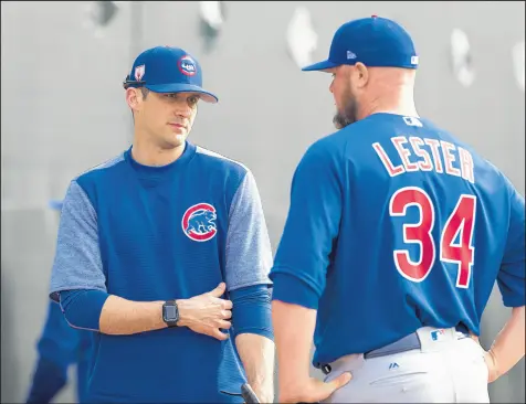  ?? BRIAN CASSELLA/CHICAGO TRIBUNE ?? Cubs pitching coach Tommy Hottovy works with starter Jon Lester during spring training in Mesa, Ariz.