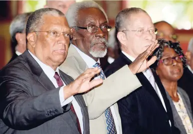  ?? LIONEL ROOKWOOD/PHOTOGRAPH­ER ?? Saying farewell to friend Noel Hylton yesterday were (from left) Opposition Leader Dr Peter Phillips, former Prime Minister P.J. Patterson, former Prime Minister Bruce Golding and his wife Lorna.