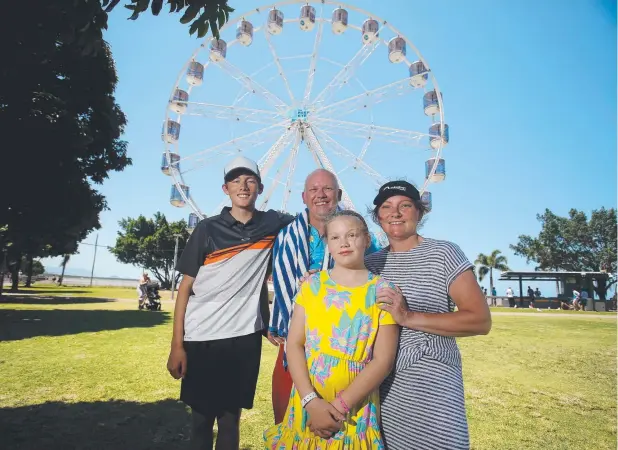  ?? Picture: STEWART McLEAN ?? GREAT VIEW: The Astell family from Tasmania – Jaren, 14, Mark, Keira, 11, and Kellie – after a ride on the Cairns Eye.