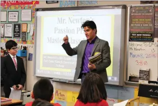  ?? Christina Cox/The Signal (See additional photos at signalscv.com) ?? Entertainm­ent Weekly senior writer Anthony Breznican speaks to Ken Newton’s sixth-grade class at Fair Oaks Ranch Community School on Thursday. Along with Breznican, Neel Shah, a doctor with Kaiser Permanente in Santa Clarita, spoke with the students...